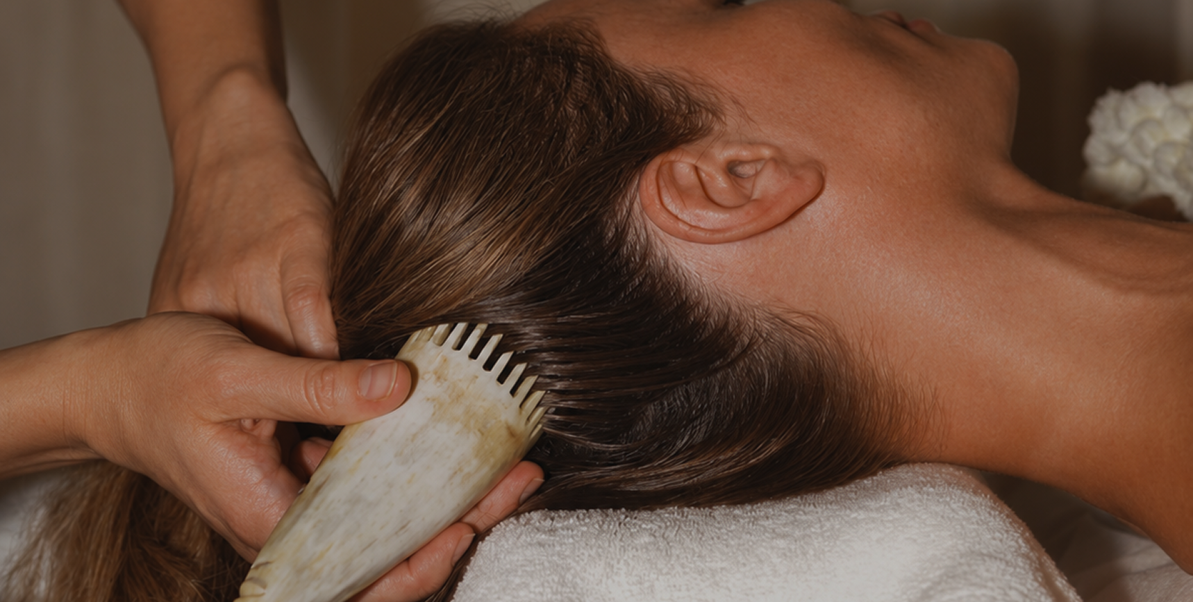 Close-up of head spa massage with traditional comb