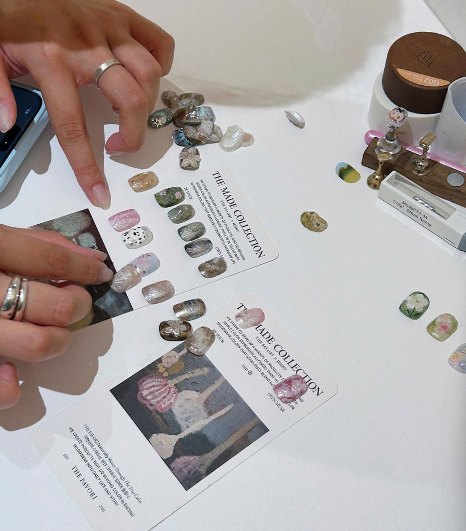 Nail tips and The Made Collection cards being arranged